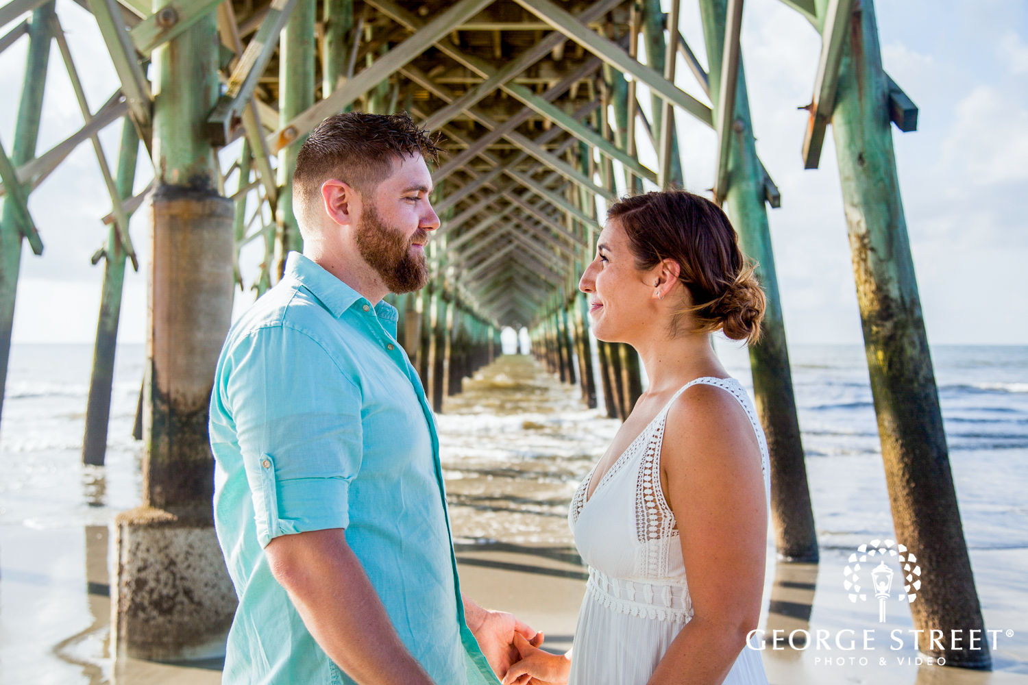 gorgeous engagement photos under pier