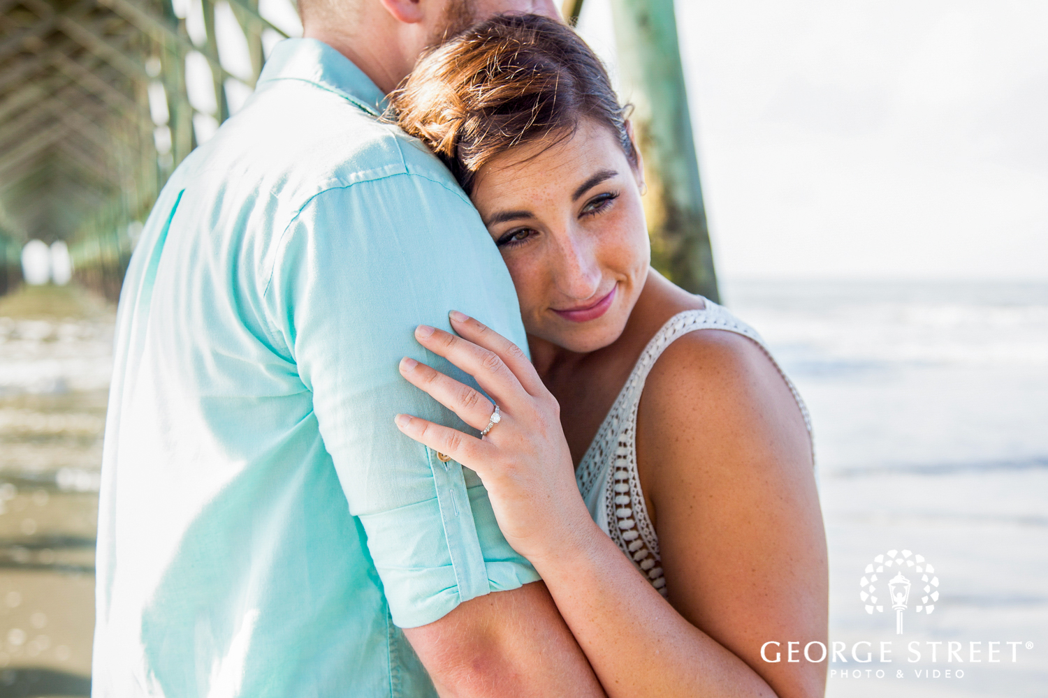 glowing beach and pier engagement photos