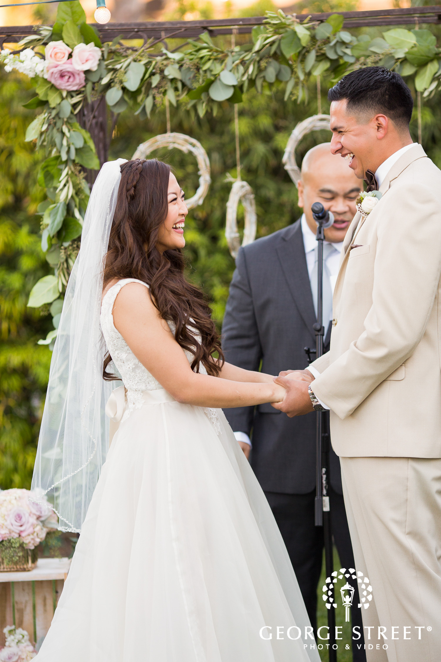 couple laughing outdoor wedding ceremony