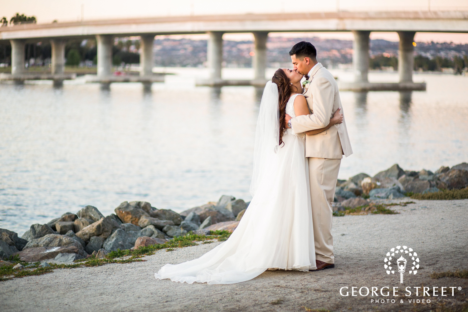 San Diego sunset wedding portrait of bride and groom by water