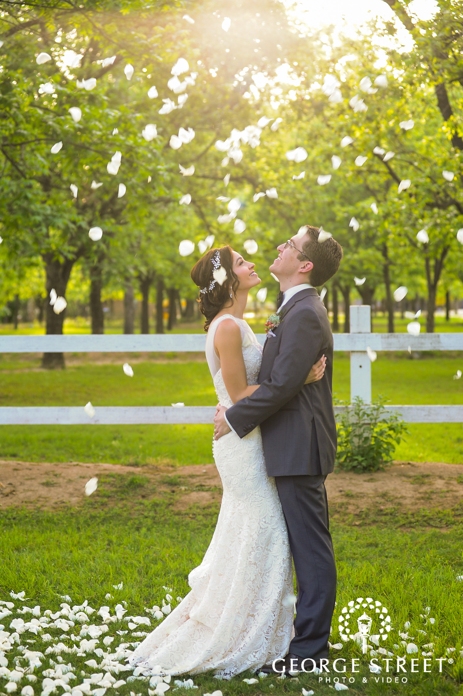 golden hour falling petals wedding photo