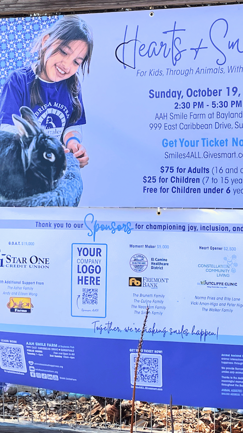 Hearts and Smiles event sign recognizing 2025 sponsors