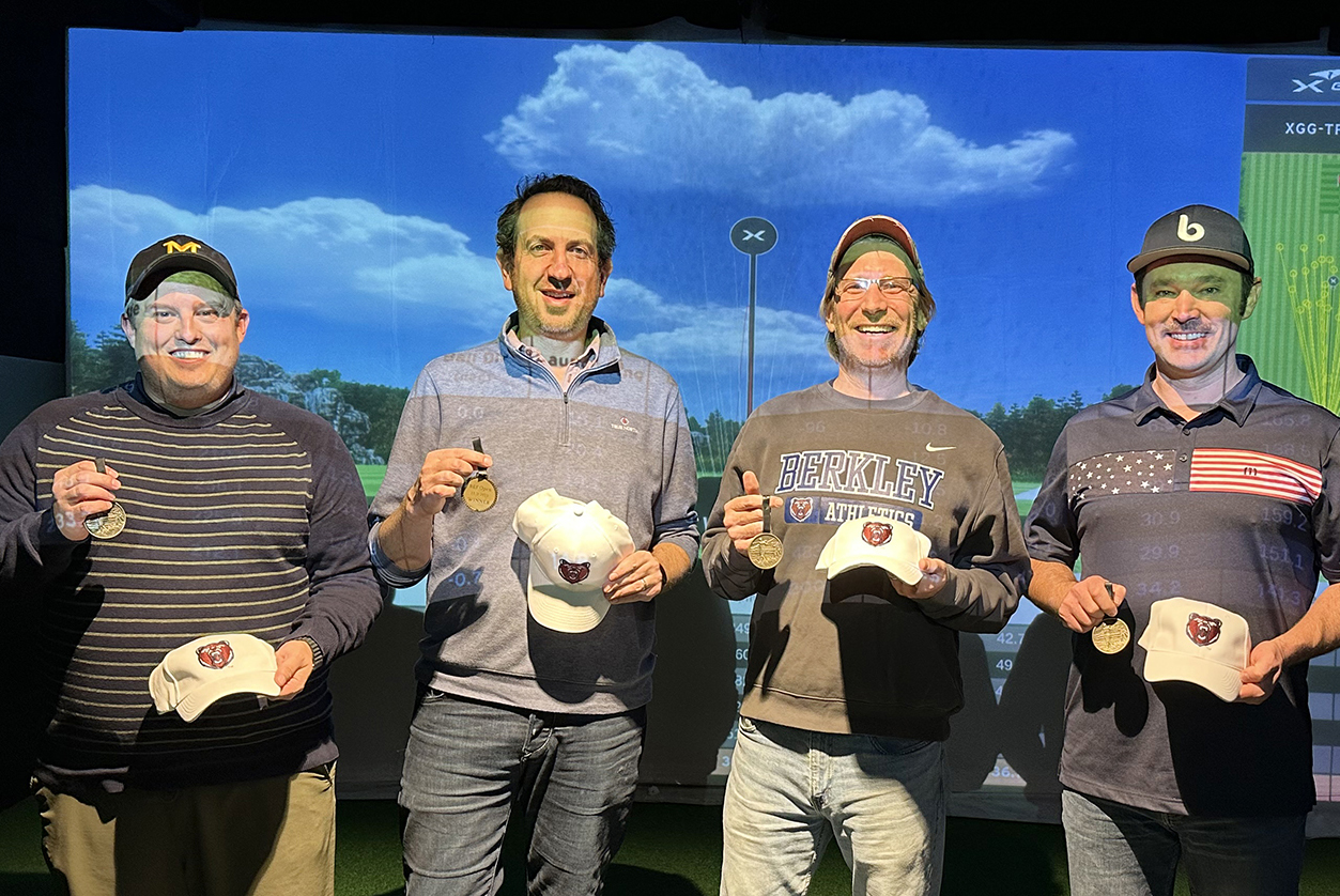 The winning team holding their medals