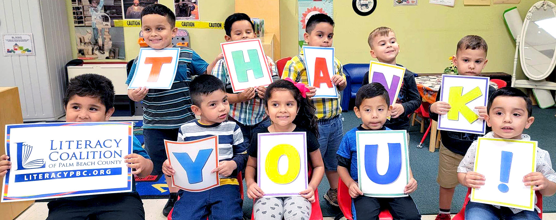 Children holding Thank You signs