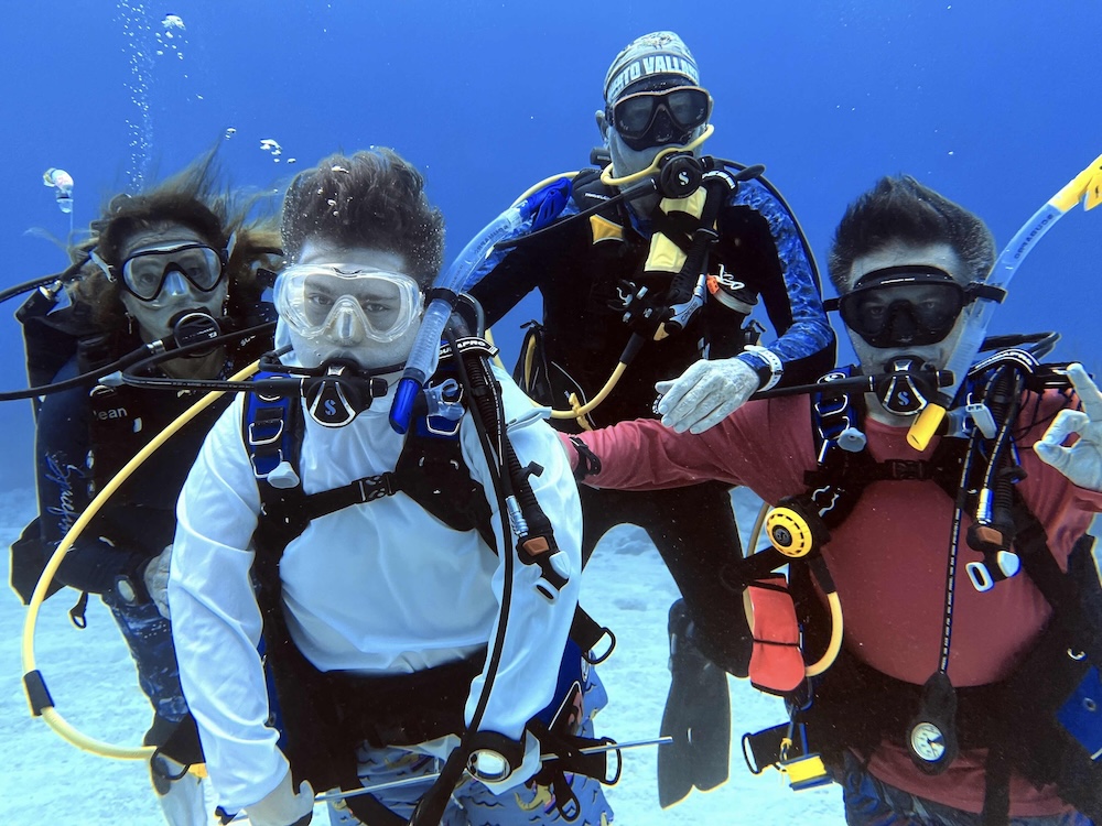 Deaken and his buddy team underwater