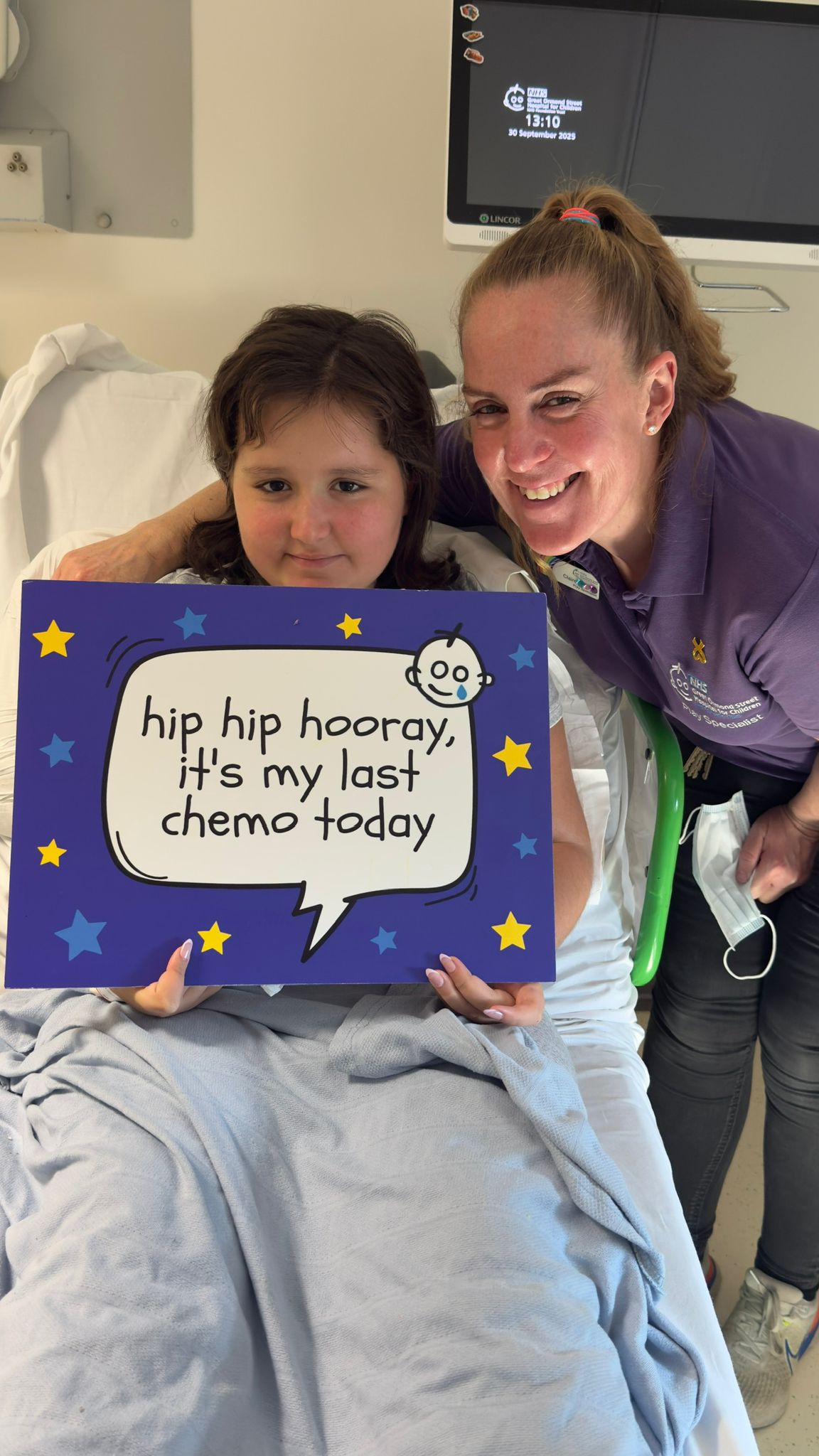 Cancer survivor Alba rings bell at Great Ormond Street Hospital