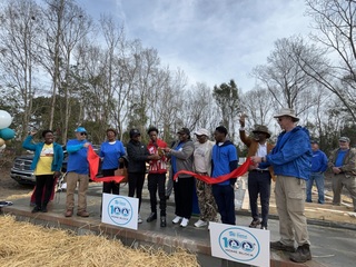 100th Home Dedication and Volunteer Day logo