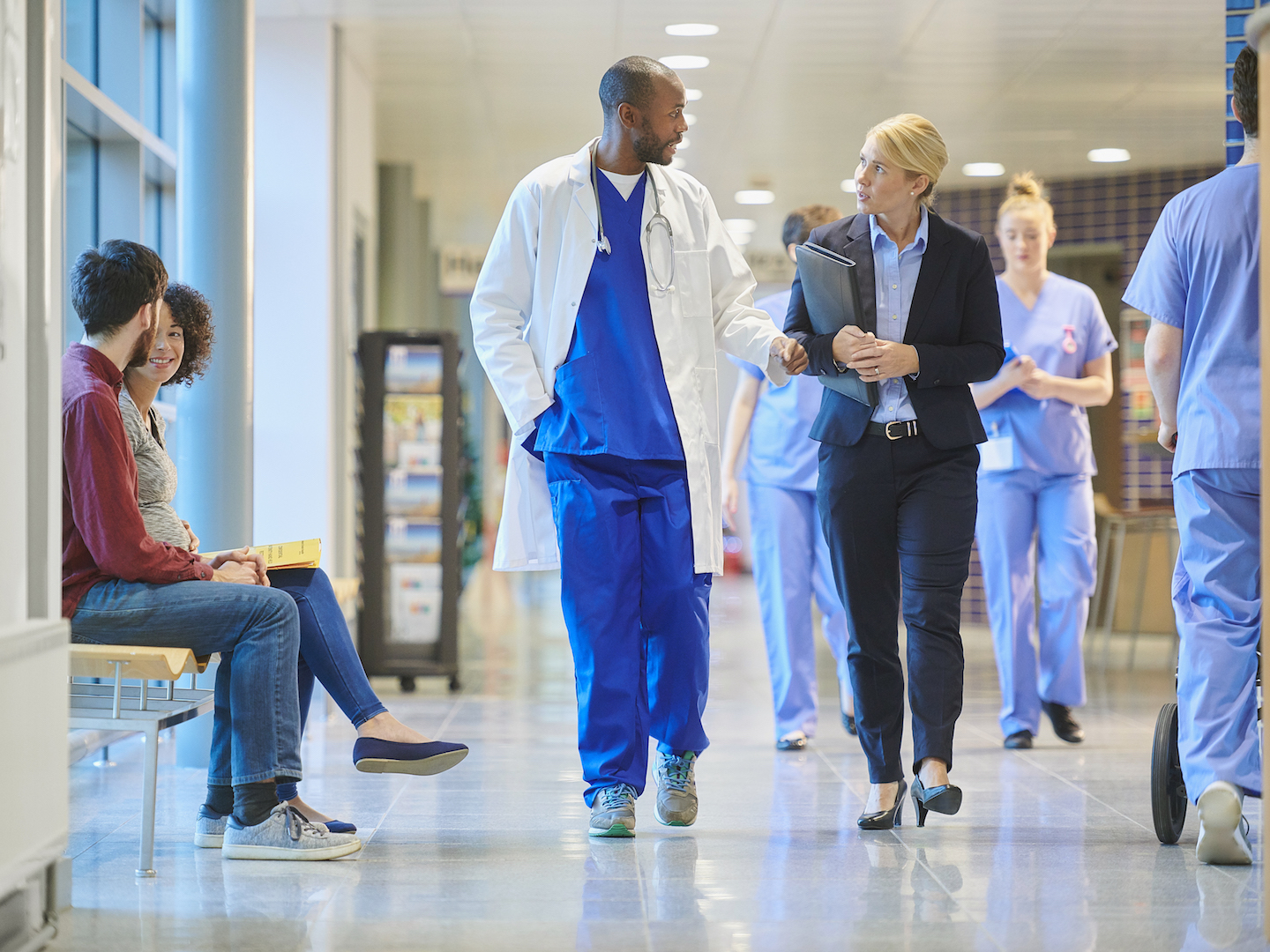 Doctors Walking in Hospital Hallway