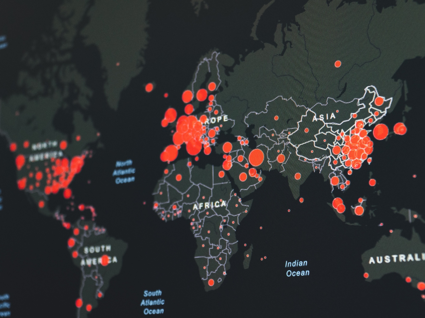 Global outbreak map with red dots depicting the size of the outbreaks