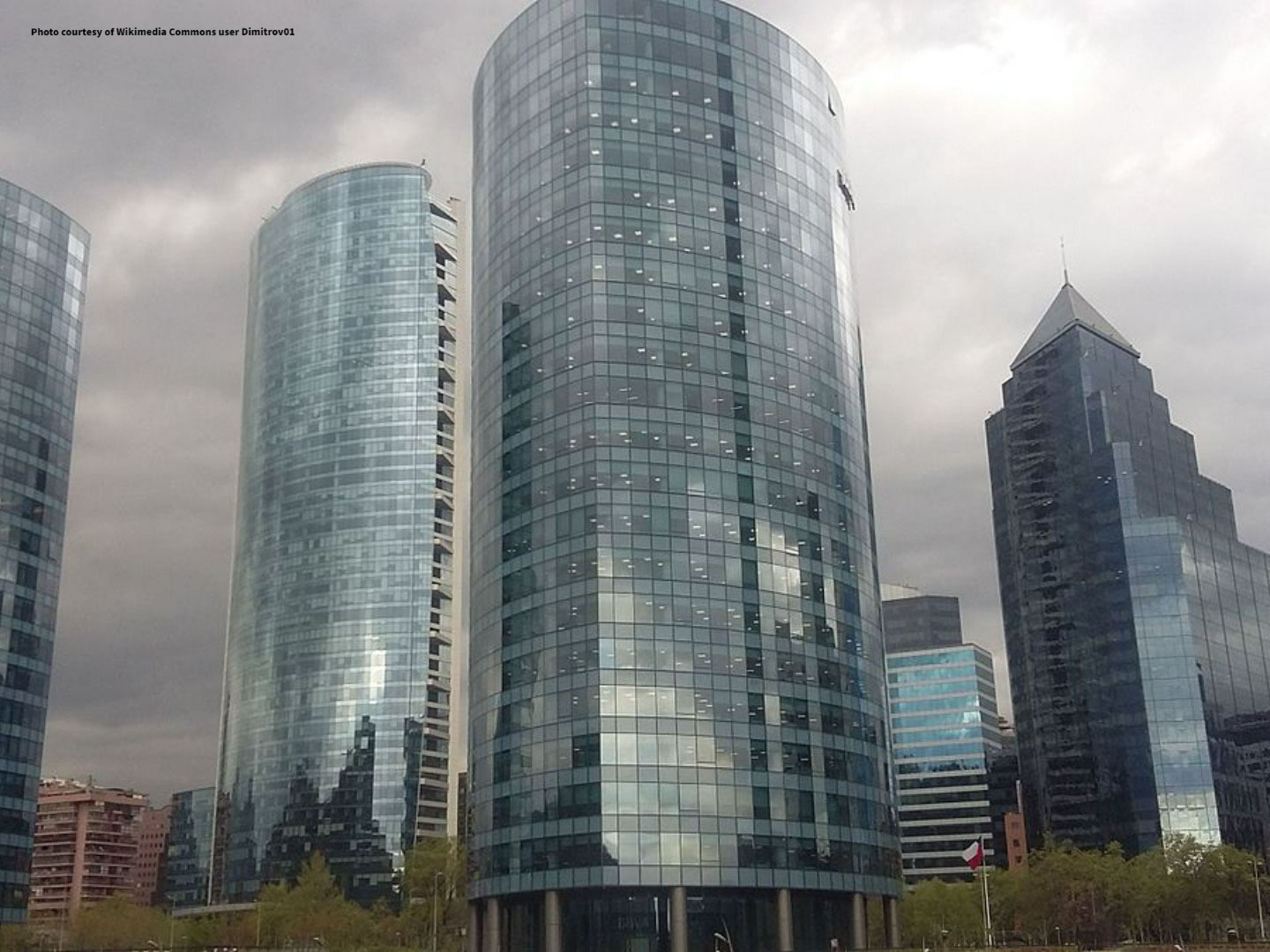 Three tall grey buildings in Santiago, Chile on a cloudy day