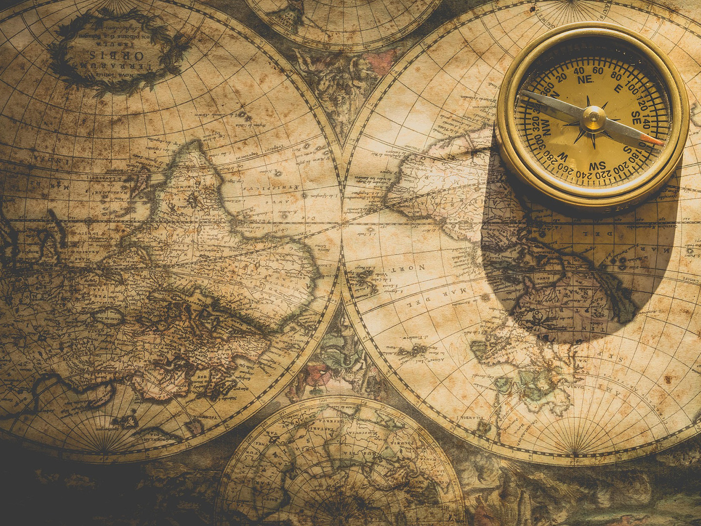 A map of the world with a compass