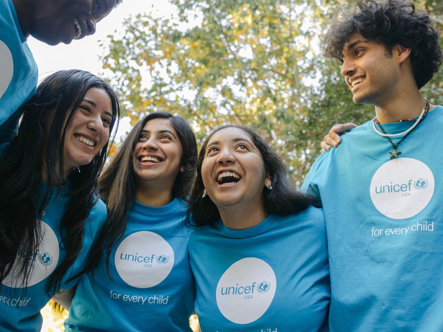 Young people embrace each other.