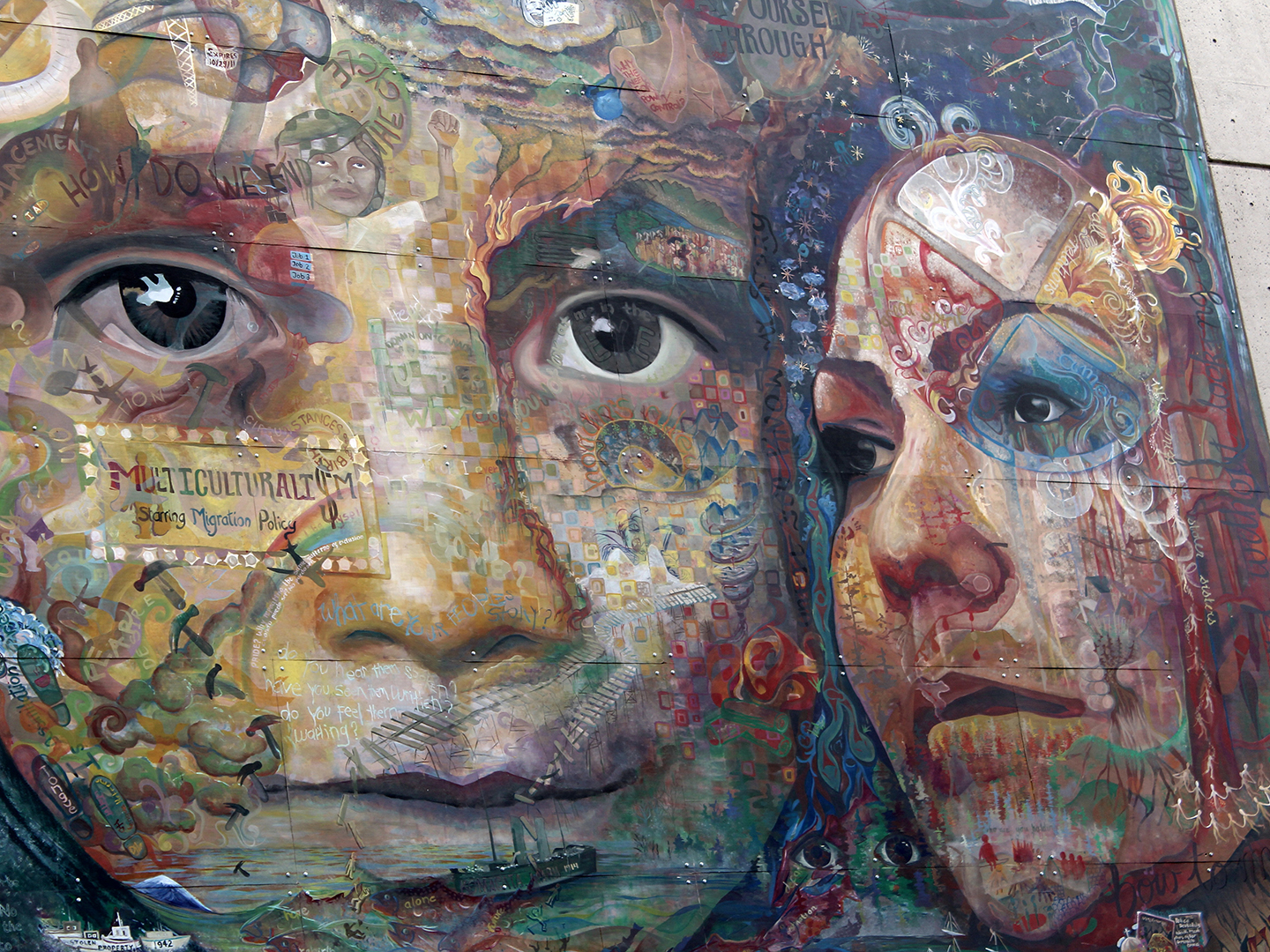 A mural of a child and woman with their faces painted