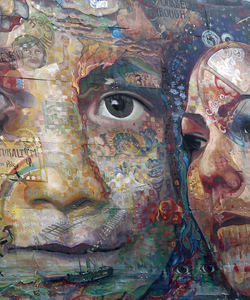 A mural of a child and woman with their faces painted