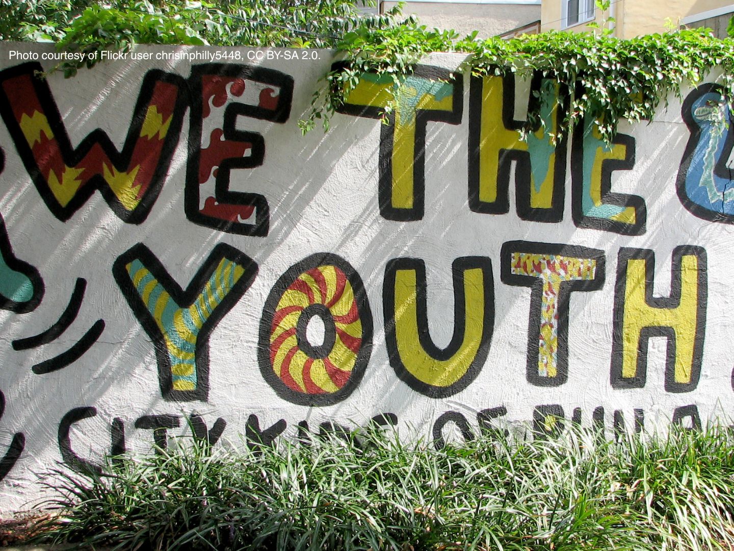 Colorful mural that says "We the Youth"