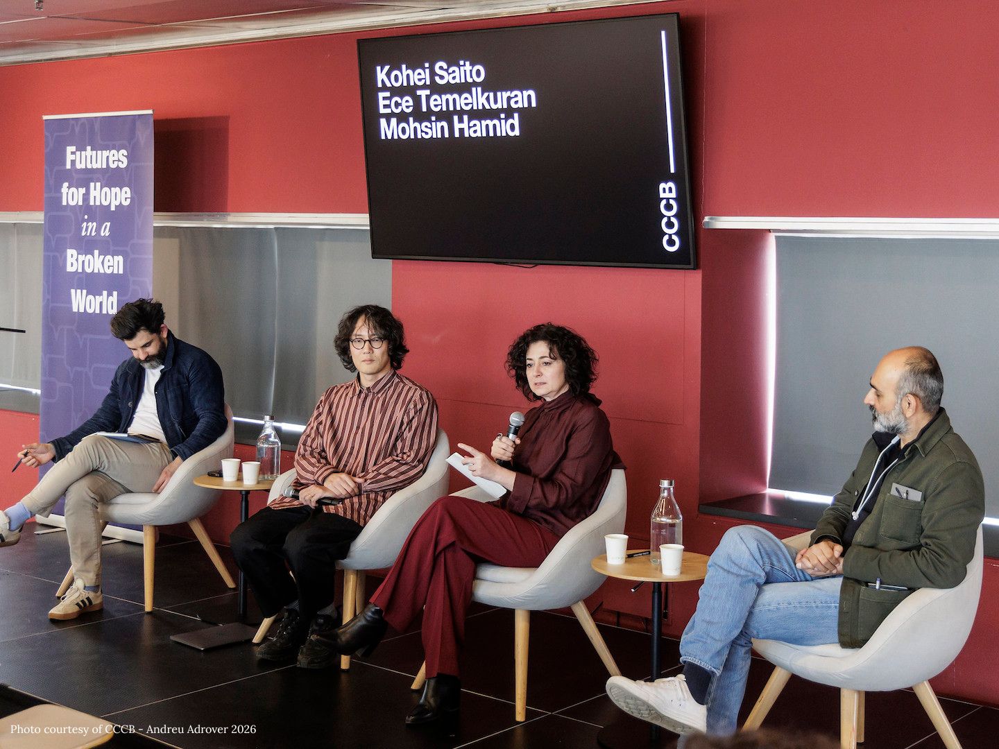 Gavin Jacobson, Kohei Saito, Ece Temelkuran, and Mohsin Hamid sit in chairs on a stage