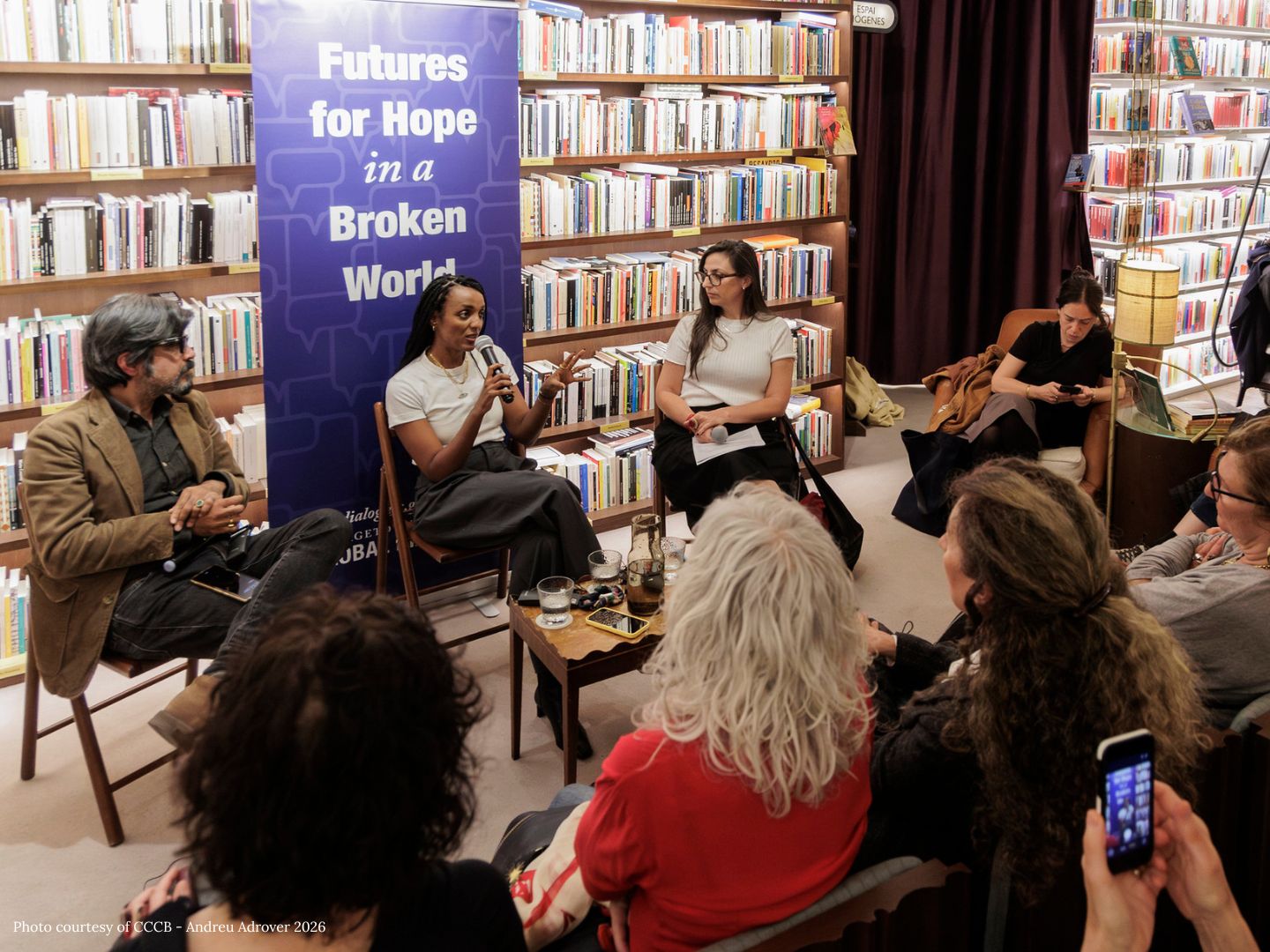 Pankaj Mishra, Nesrine Malik, and Verónica Gago sit in front of a wall of books. "Futures for Hope in a Broken World"