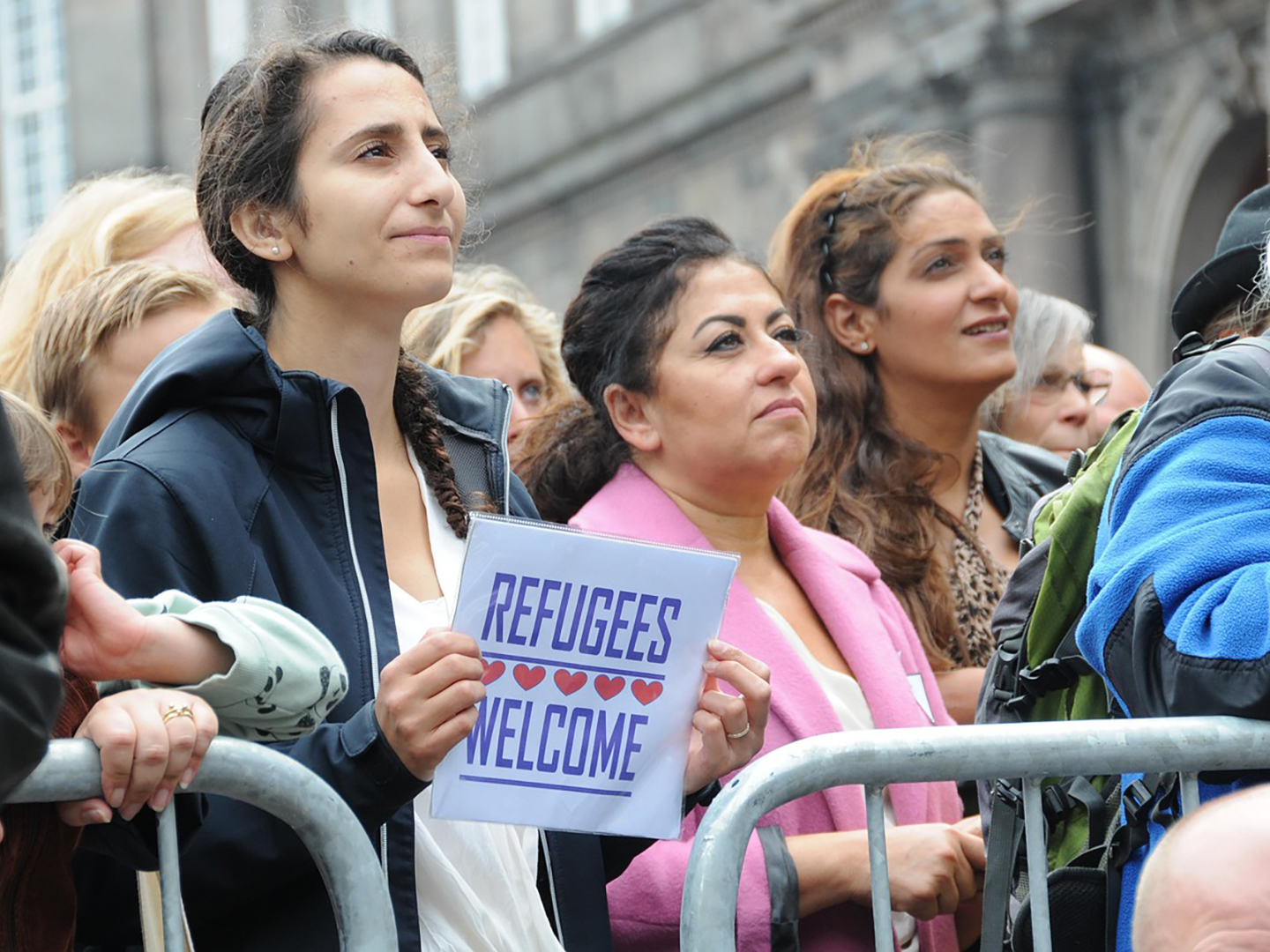 Women demonstrate in support of refugee rights.