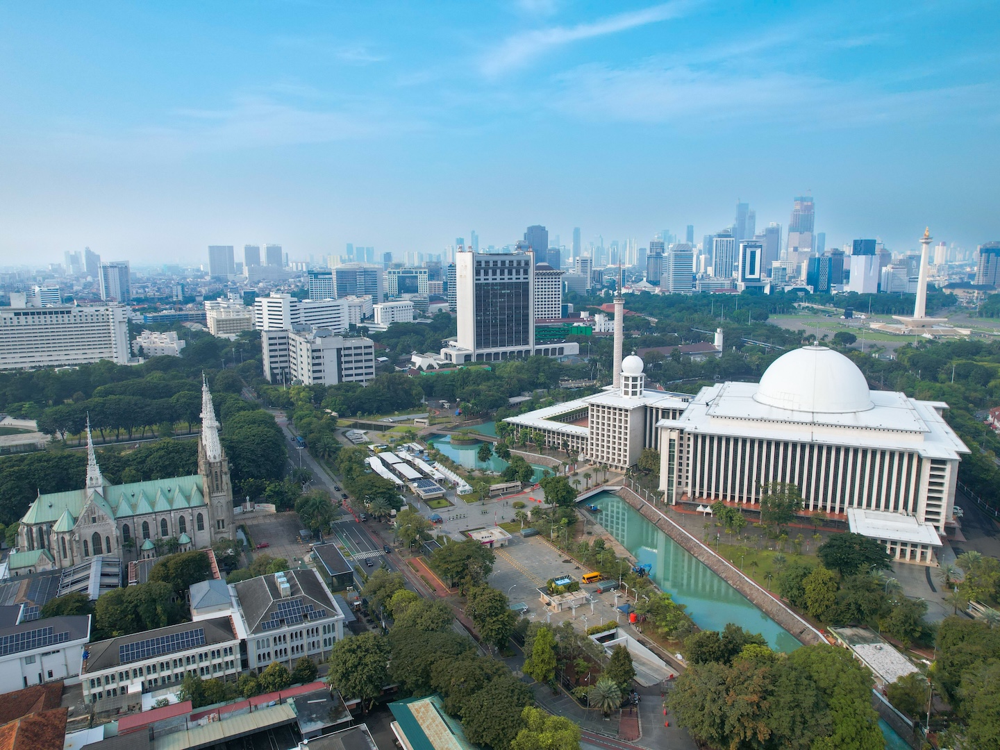 An aerial shot of the Jakarta cathedral and mosque side by side