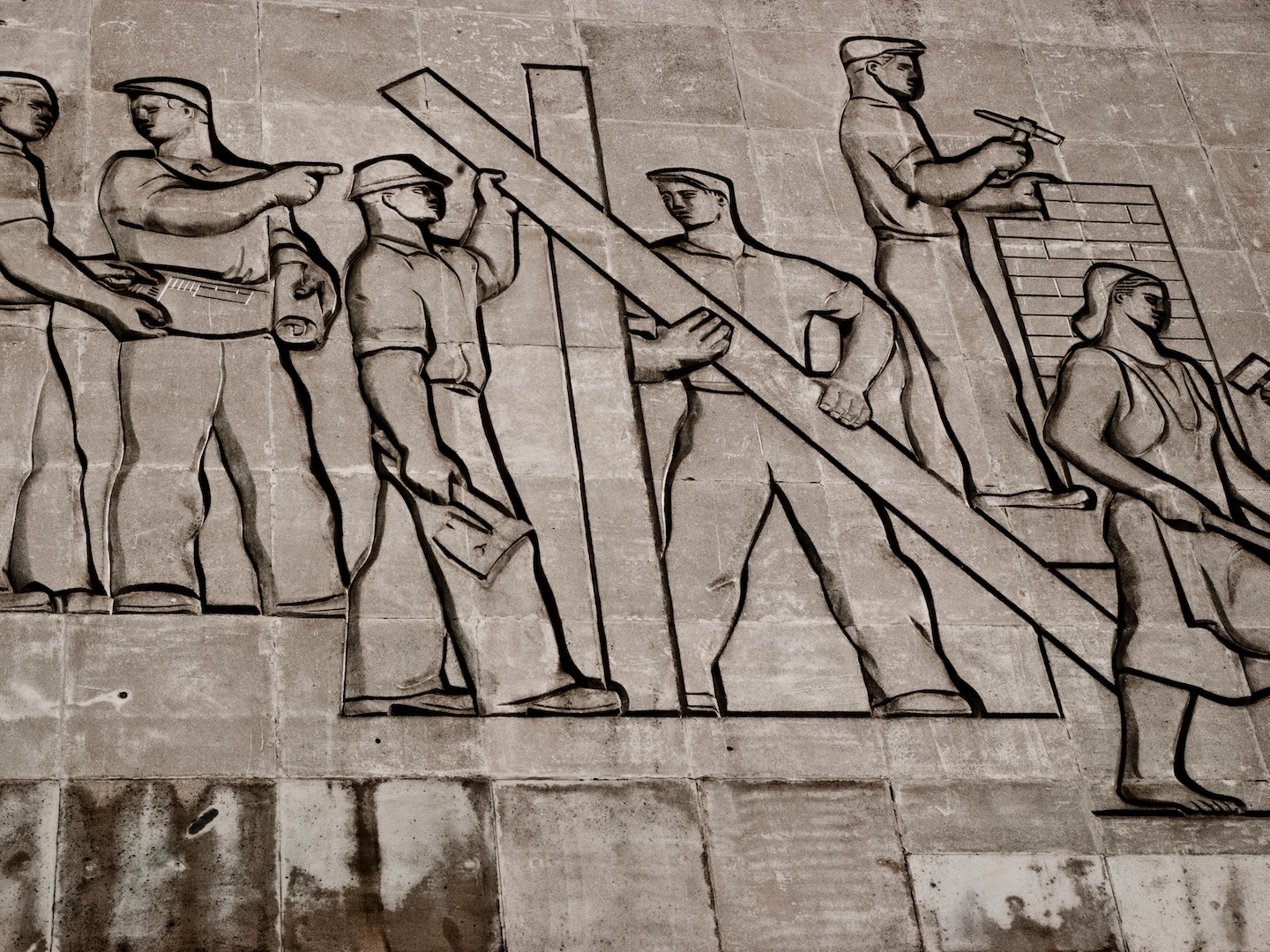 A Soviet-era mural depicting people at work