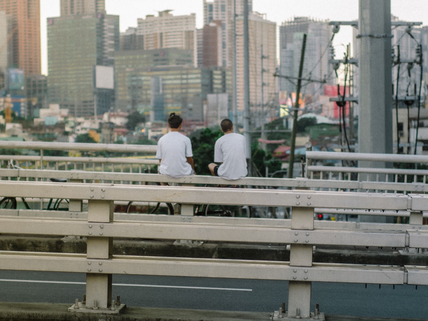 Two young people overlook a city skyline
