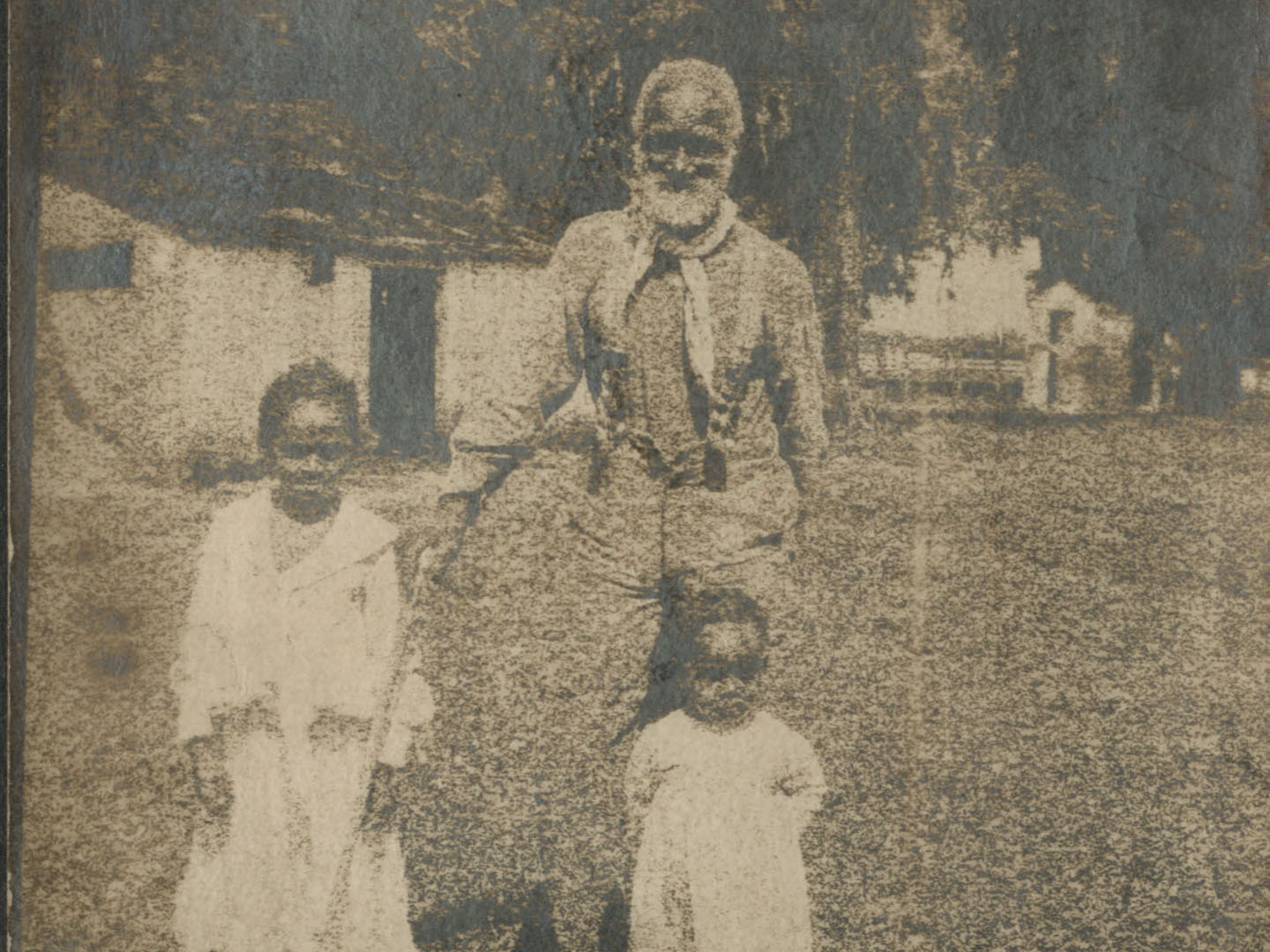 Frank Campbell and two children. Photo held in the Georgetown Slavery Archive.