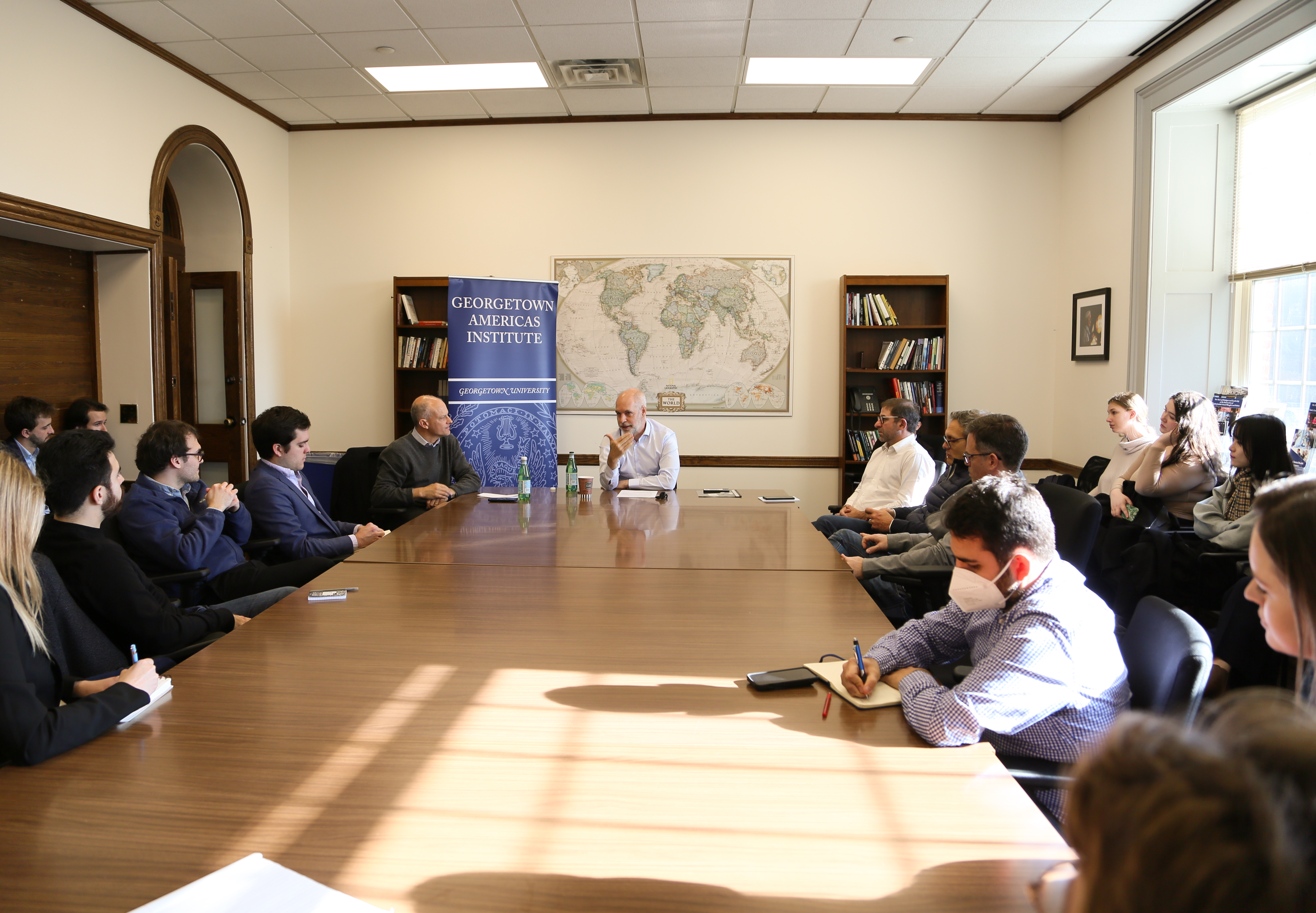 Horacio Rodríguez Larreta speaks with students accompanied by GAI founding director Alejandro Werner at Maguire Hall.