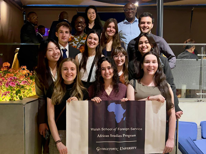 Students at the alumni reception with Associate Professor Ken Opalo