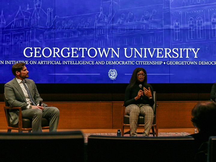 Mark Fisher and Chinasa T. Okolo at the March 25 panel discussion on Making AI Work for the People.