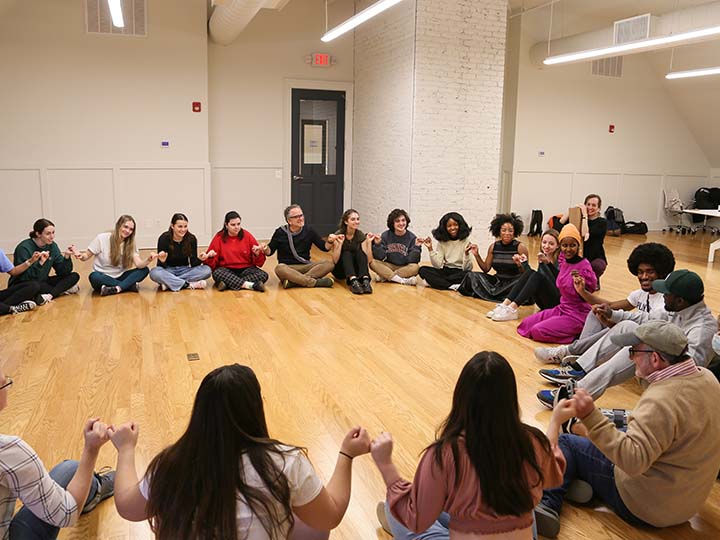 Participants sit in a circle during Ifrah Mansour and Emma Jaster's workshop "Healing with Humor"