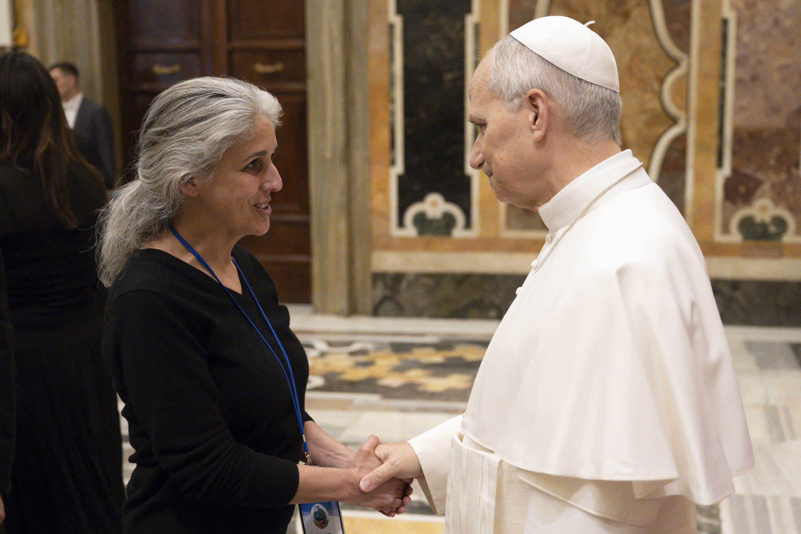 Executive Director Gillian Huebner shakes hands with Pope Leo XIV at the Vatican on February 5, 2026. Photo credit: © Vatican Media.