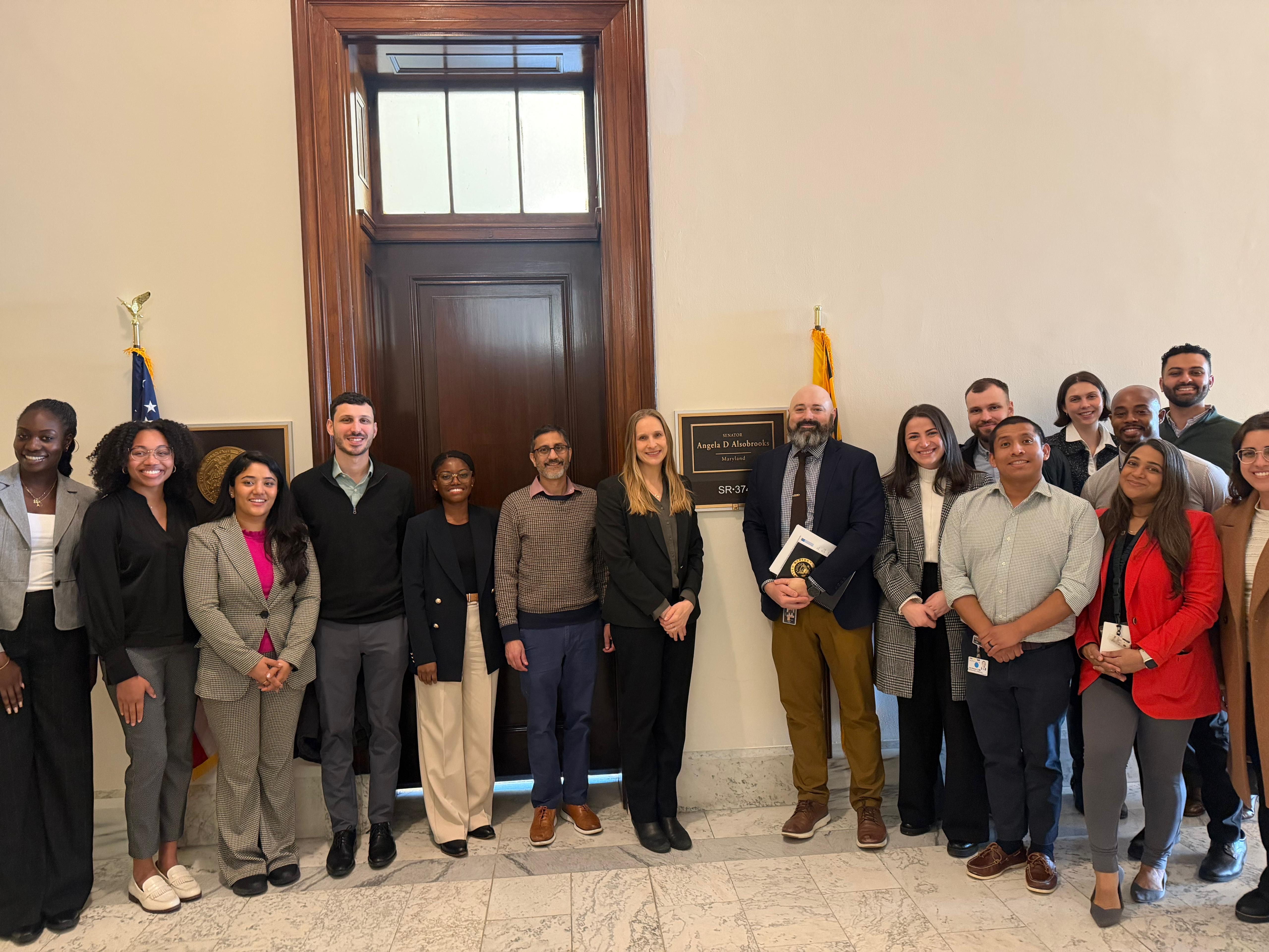 Kayla Wontumi (H’27), a Global Health Student Fellow and Maeve Kennedy McKean Award recipient, with residents and faculty outside Senator Angela Alsobrooks’(D-MD) office.