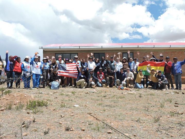 Global Builders, Bolivian families, Bolivian students, the Red Cross, and American Embassy staff gather for a "Volunteer Day"