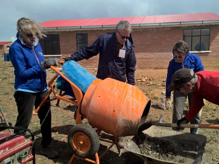 Fuller Center for Housing Bolivia volunteers pour cement