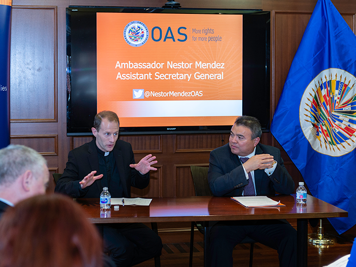 Father Matthew Carnes and Ambassador Nestor Mendez