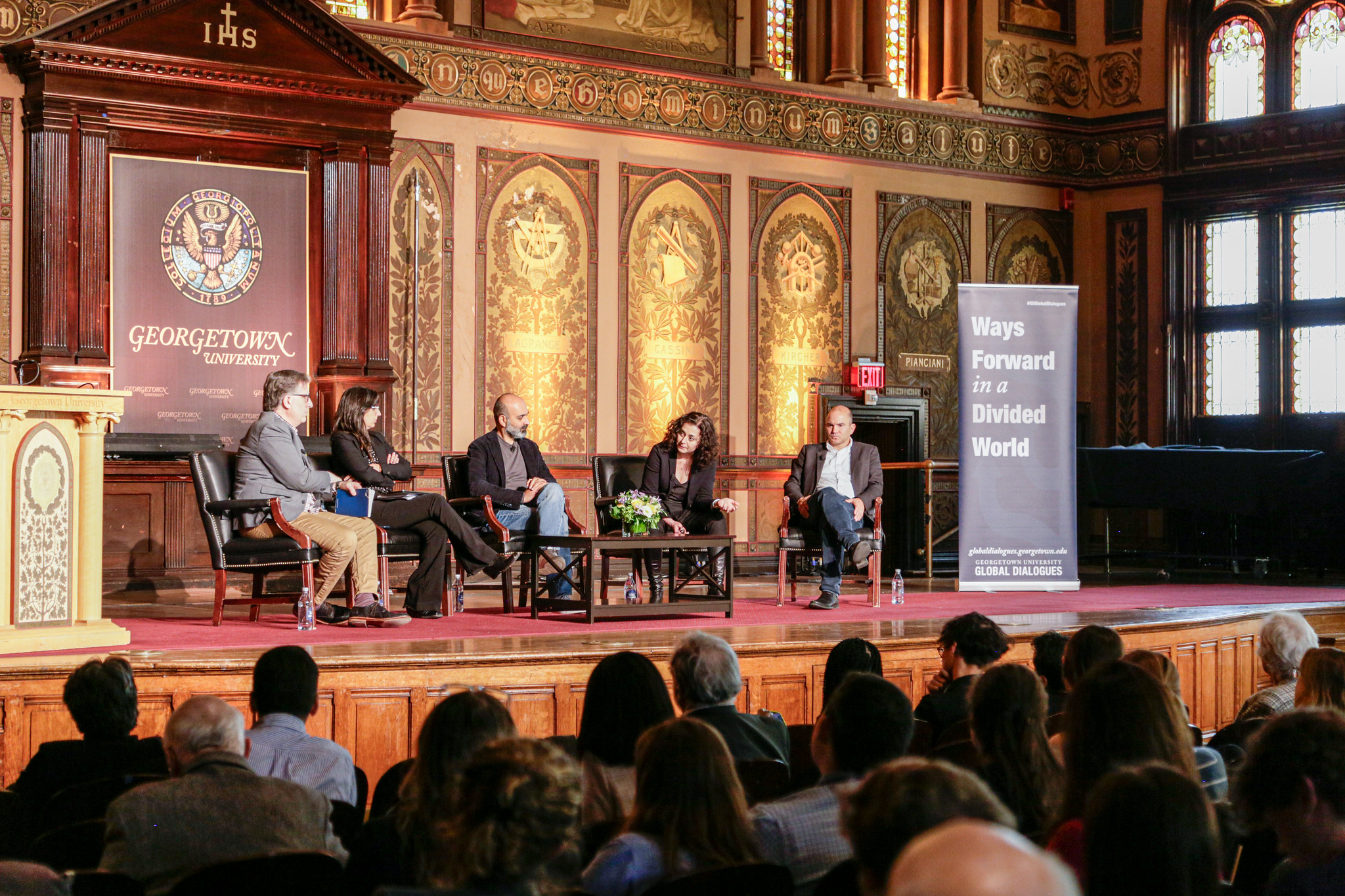 Leonard Bernardo, Verónica Gago, Mohsin Hamid, Ece Temelkuran, and Ben Rhodes speak on a GGD panel in Gaston Hall.