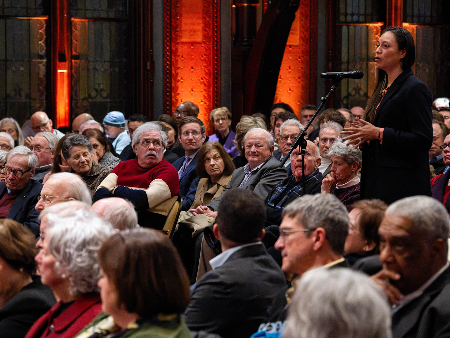An audience member asks the participants a question, January 21, 2026, in Gaston Hall.