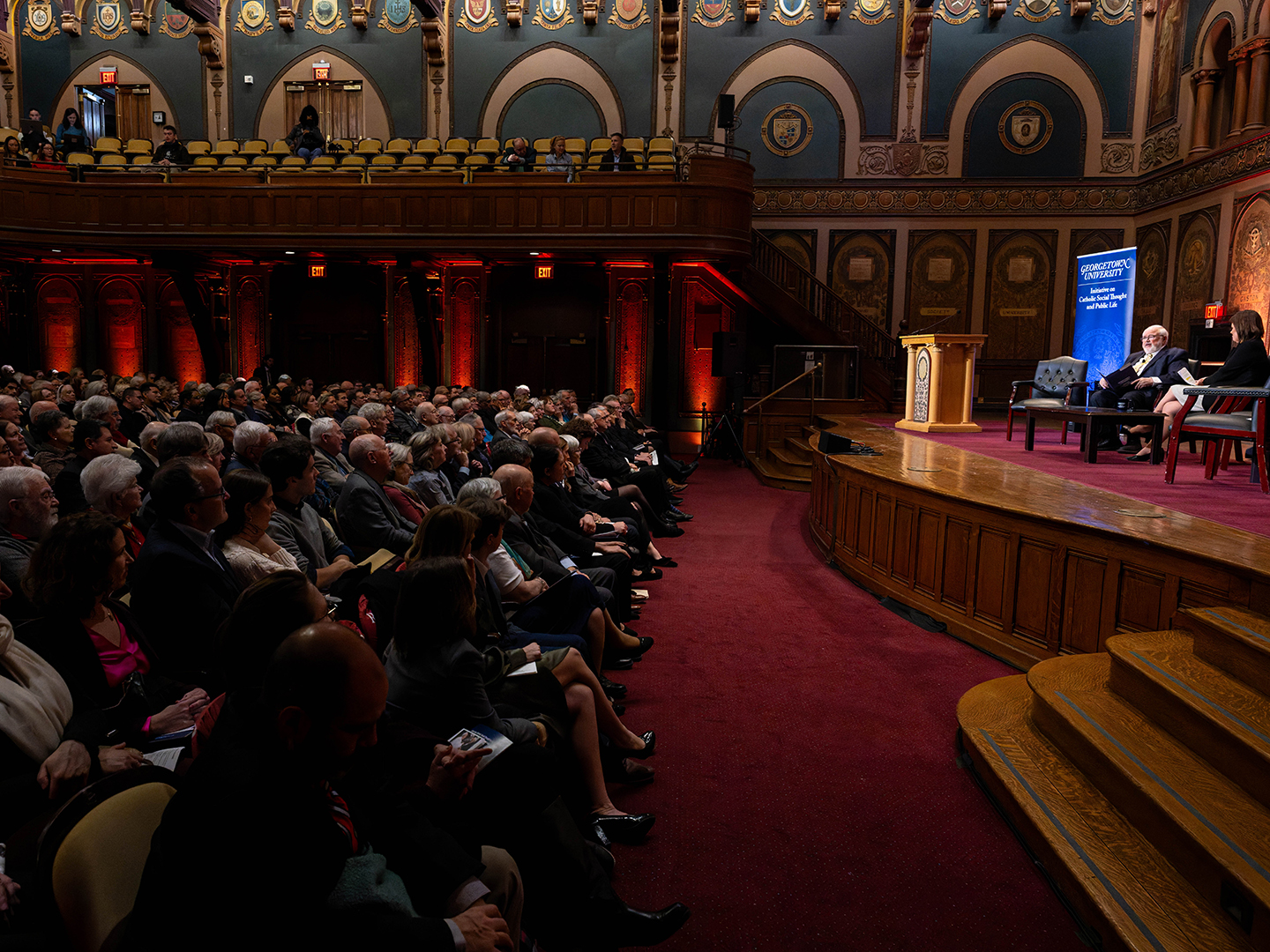 Audience members, January 21, 2026, in Gaston Hall.