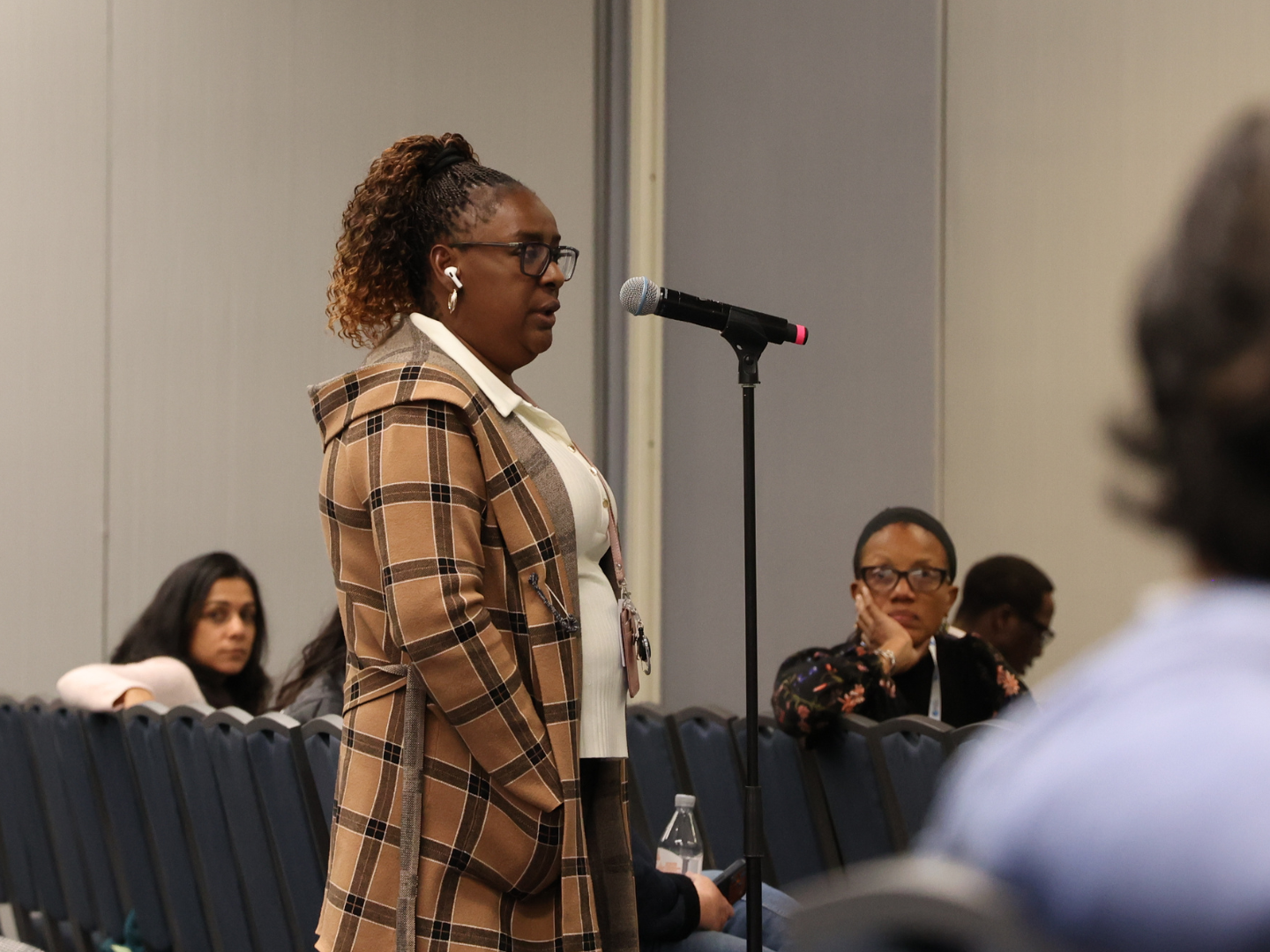 Ph.D. student Martha Cameron (G’25, G’30) asked a question during a conference session.