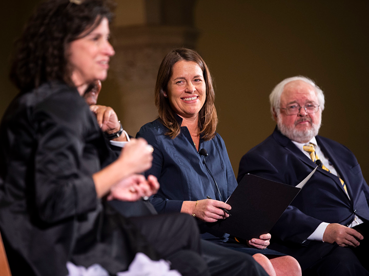 Moderator Kim Daniels listens to Helen Alvaré's response.