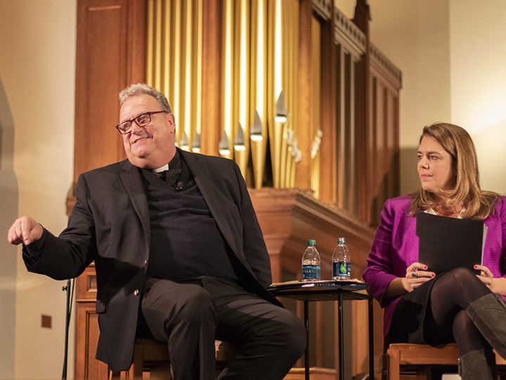 Panelists speak in Dahlgren Chapel
