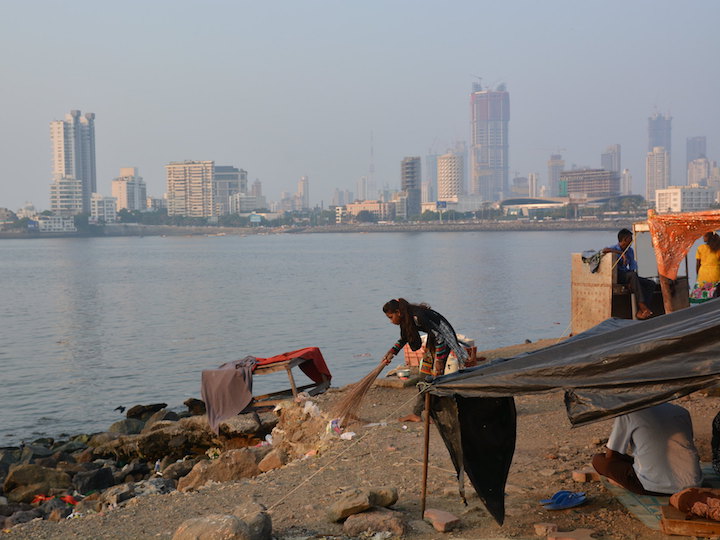 Woman working in front of the Mumbai skyline