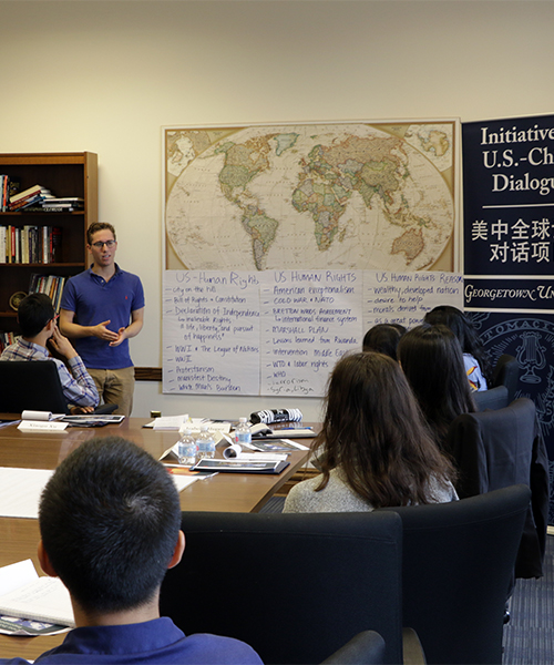 Student fellows around a table