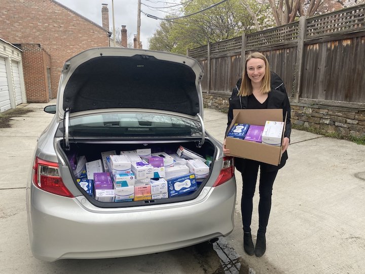 Allison Rooney, one of the MedSupplyDrive founders, loads a car with PPE. Photo courtesy of MedSupplyDrive