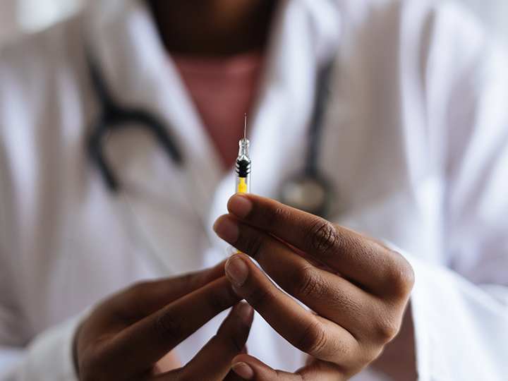 Doctor holding a needle