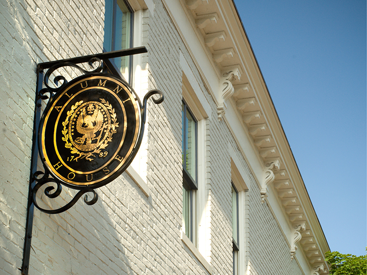 Alumni House sign featuring the Georgetown University seal