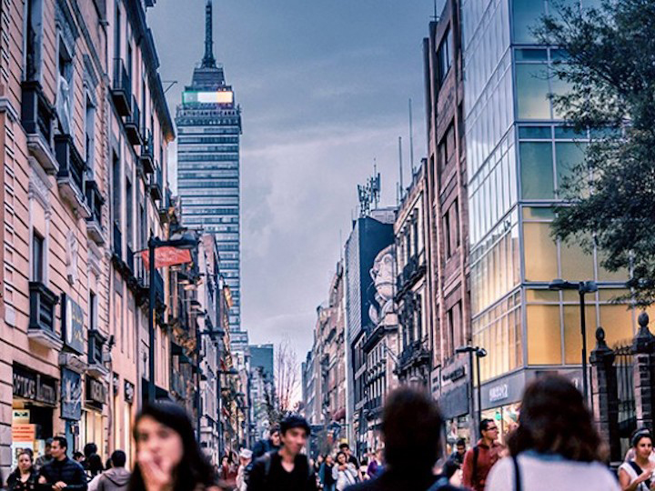 People walking amid skyscrapers