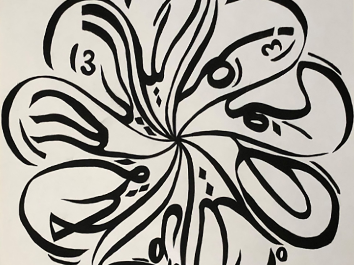 Arabic calligraphy which is drawn in a circular, almost floral shape