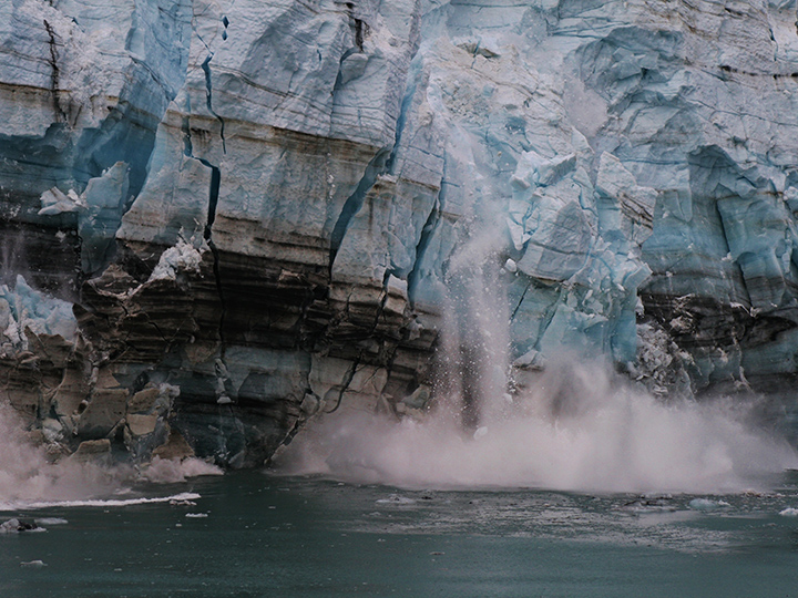 A glacier melting into the ocean