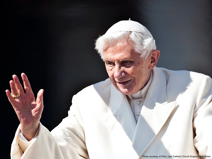 Pope Benedict XVI waving to worshippers.